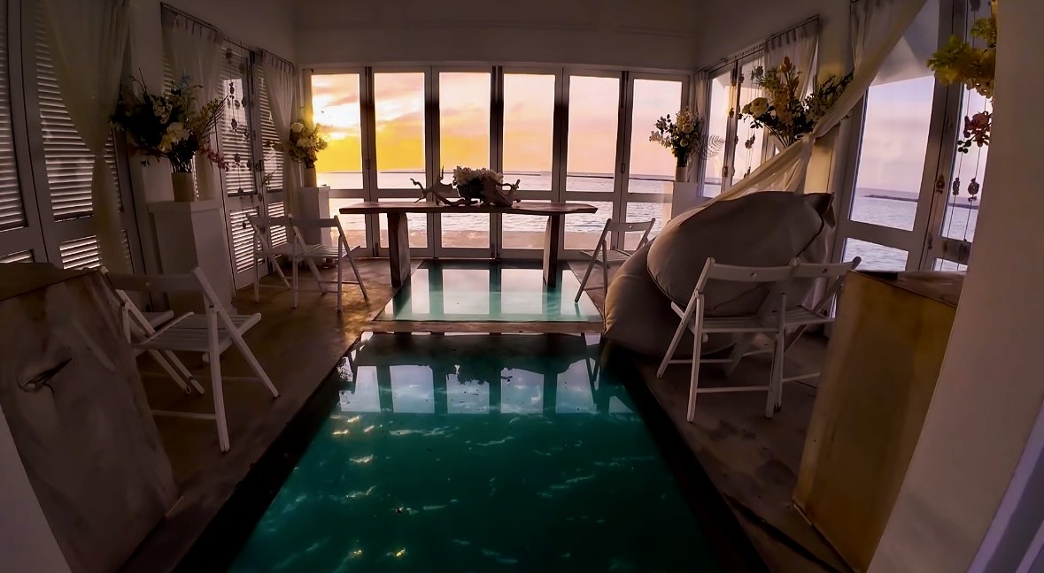 Resort interior overlooking the ocean at sunset in the Maldives